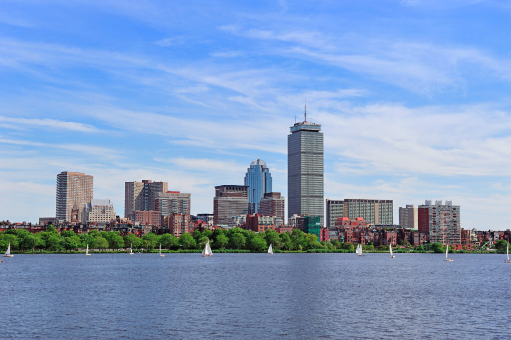 Boston Skyline to represent an article that talks about "How to get a $50,000 grant to buy a house in Massachusetts"